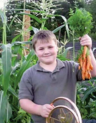 Boy holding carrots