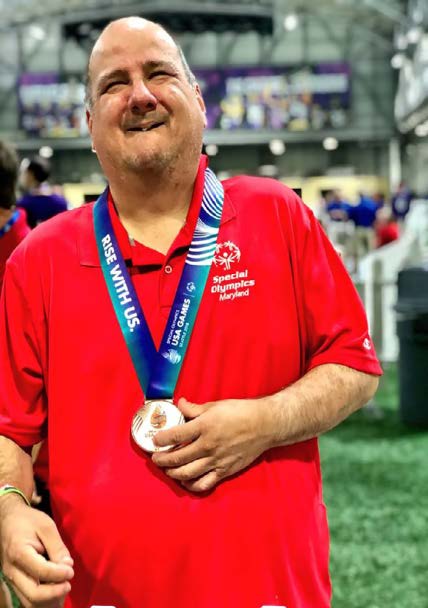 BEN COLLINS WITH HIS SPECIAL OLYMPICS MEDAL