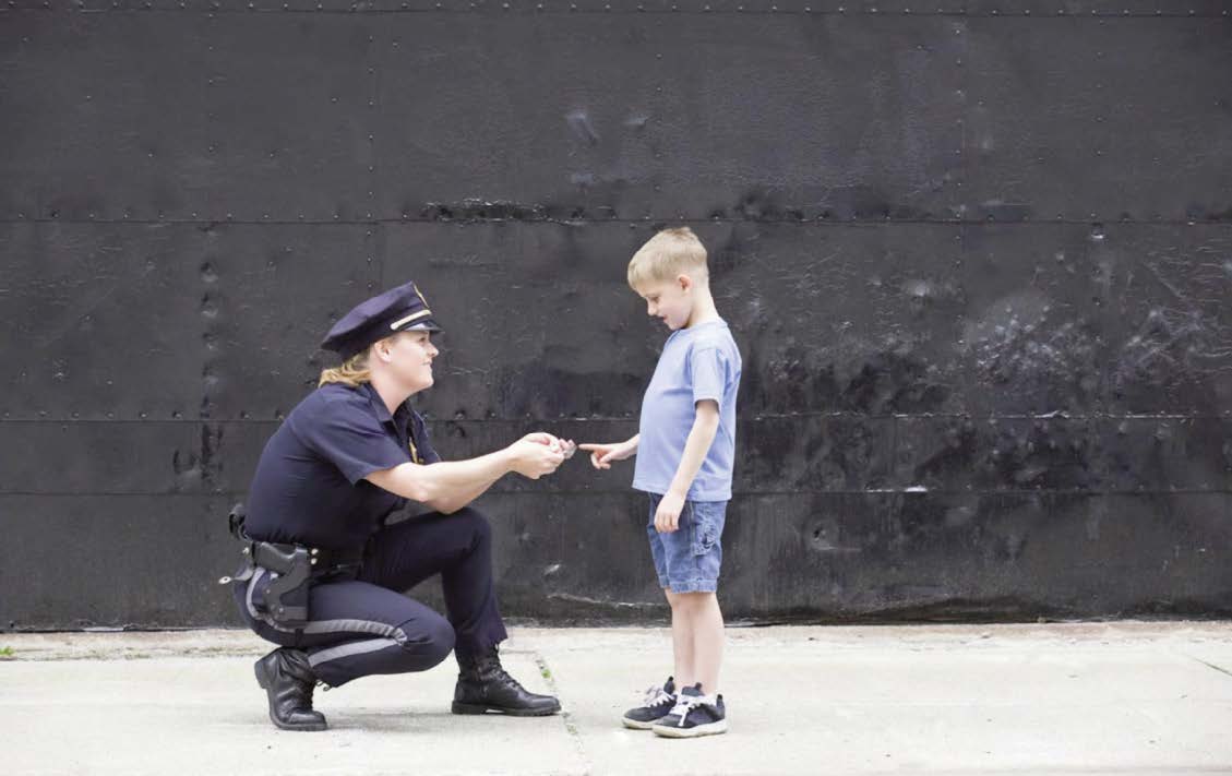 Police officer talking to a child