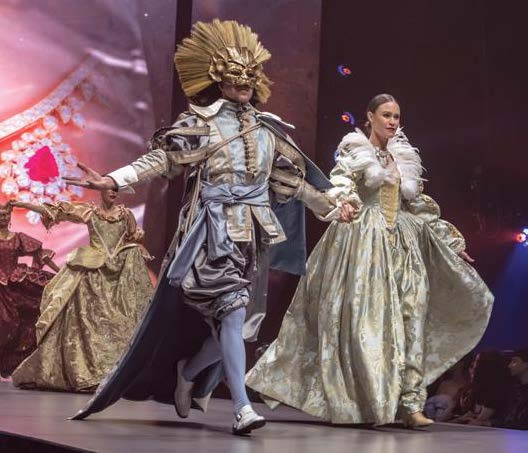 man and women in costume on stage