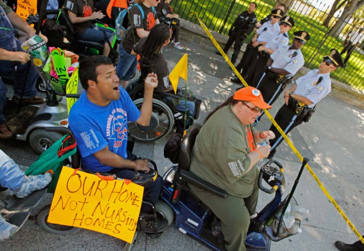 PROTESTERS FROM ADAPT BLOCKING A SIDEWALK NEAR WHITE HOUSE