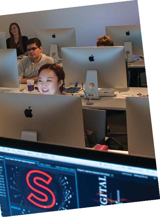 Kids working on imac computers