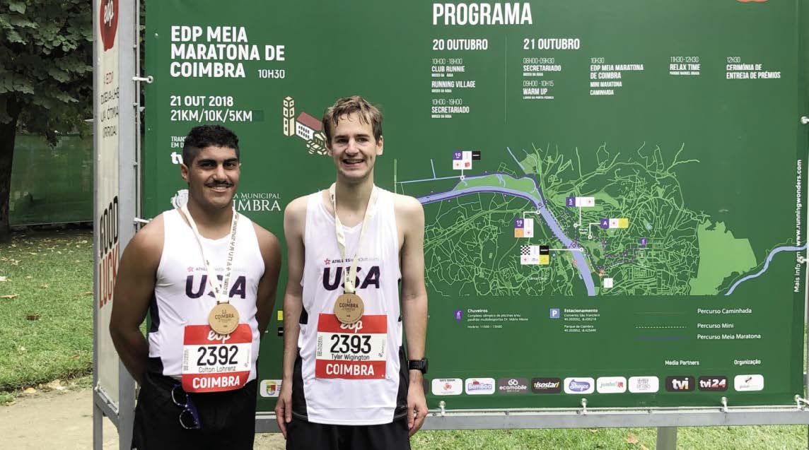 TWO RUNNERS WITH MEDALS