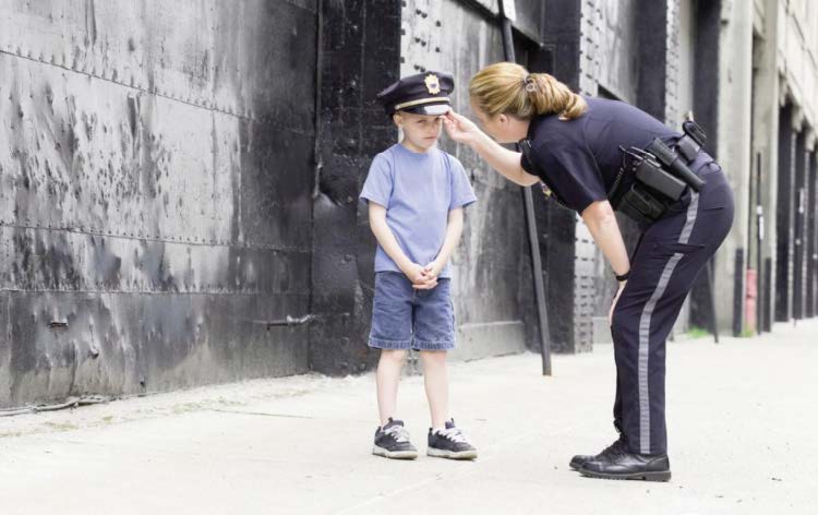 Police officer talking to a child