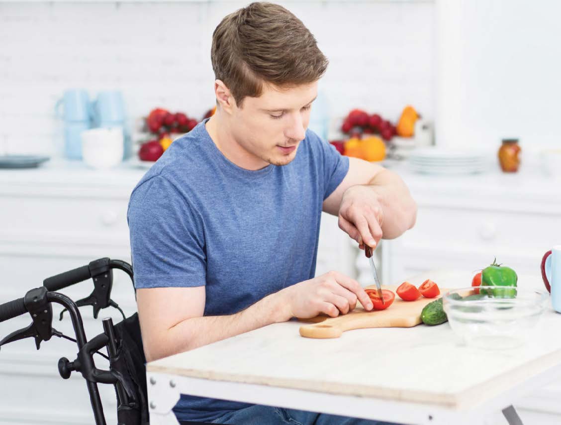 MAN CUTTING VEGETABLES